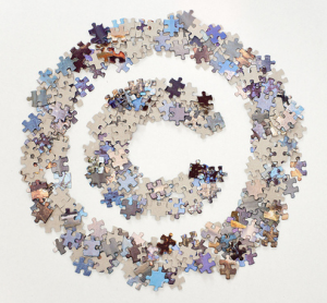 Copyright symbol made of jigsaw puzzle pieces